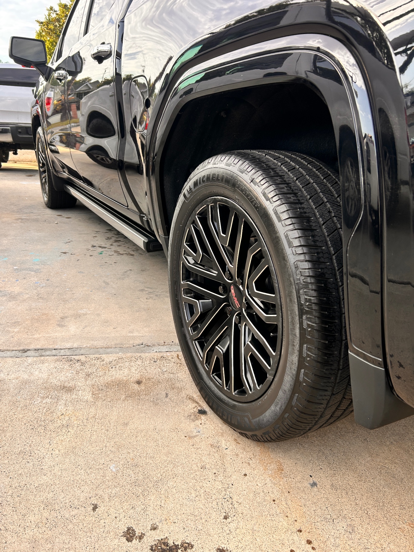 Freshly detailed GMC with polished wheel and gloss finish
